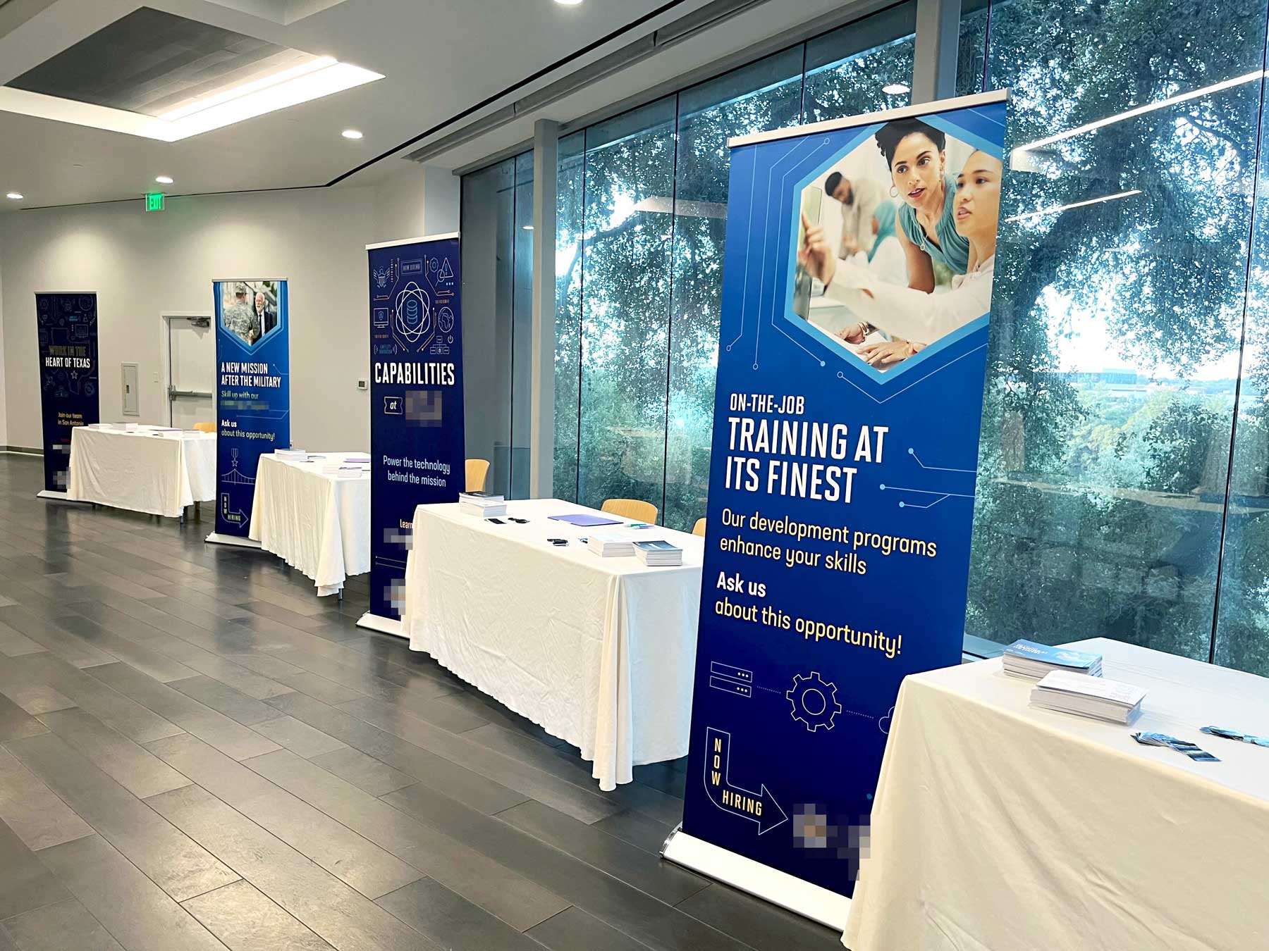 Pop up banners at the event next to their respective booths