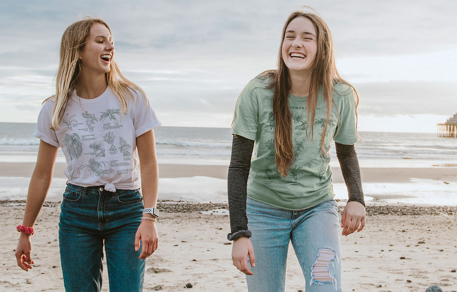 Two girls laughing on the beach