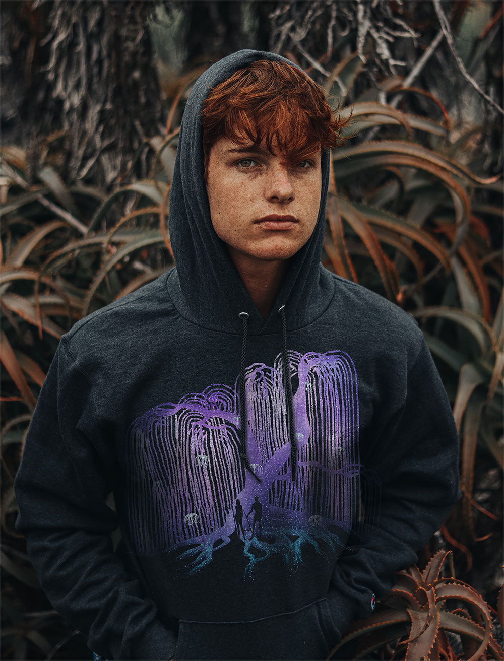 Male wearing a hoodie with an Avatar graphic