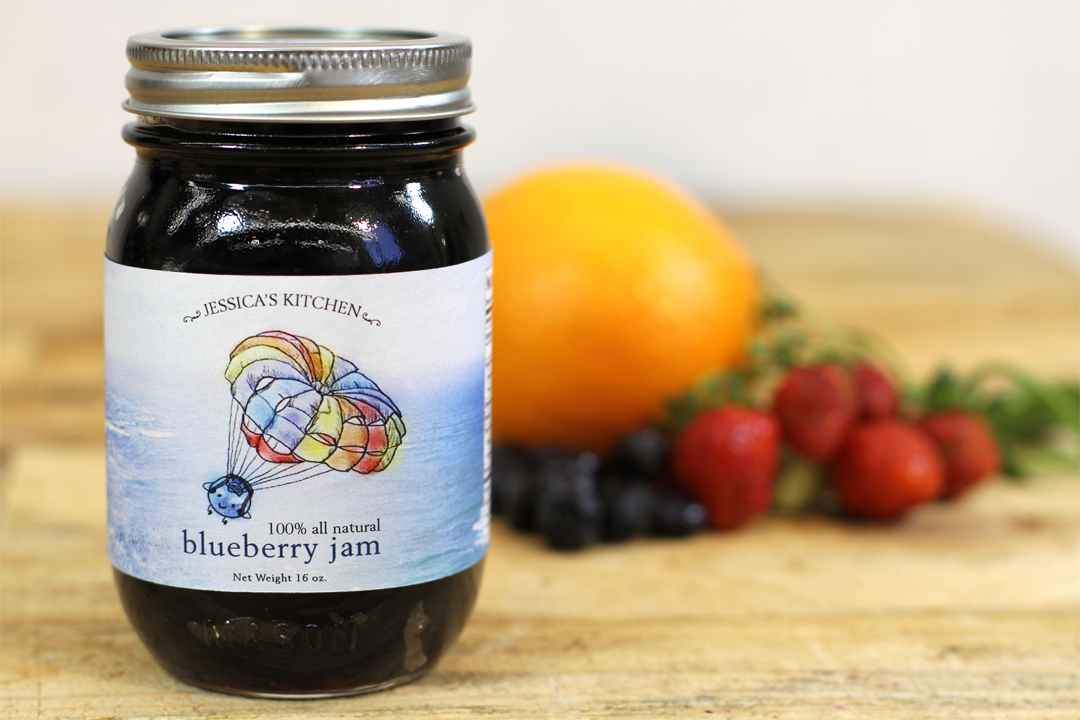 Blueberry jam photographed with fruit on the side