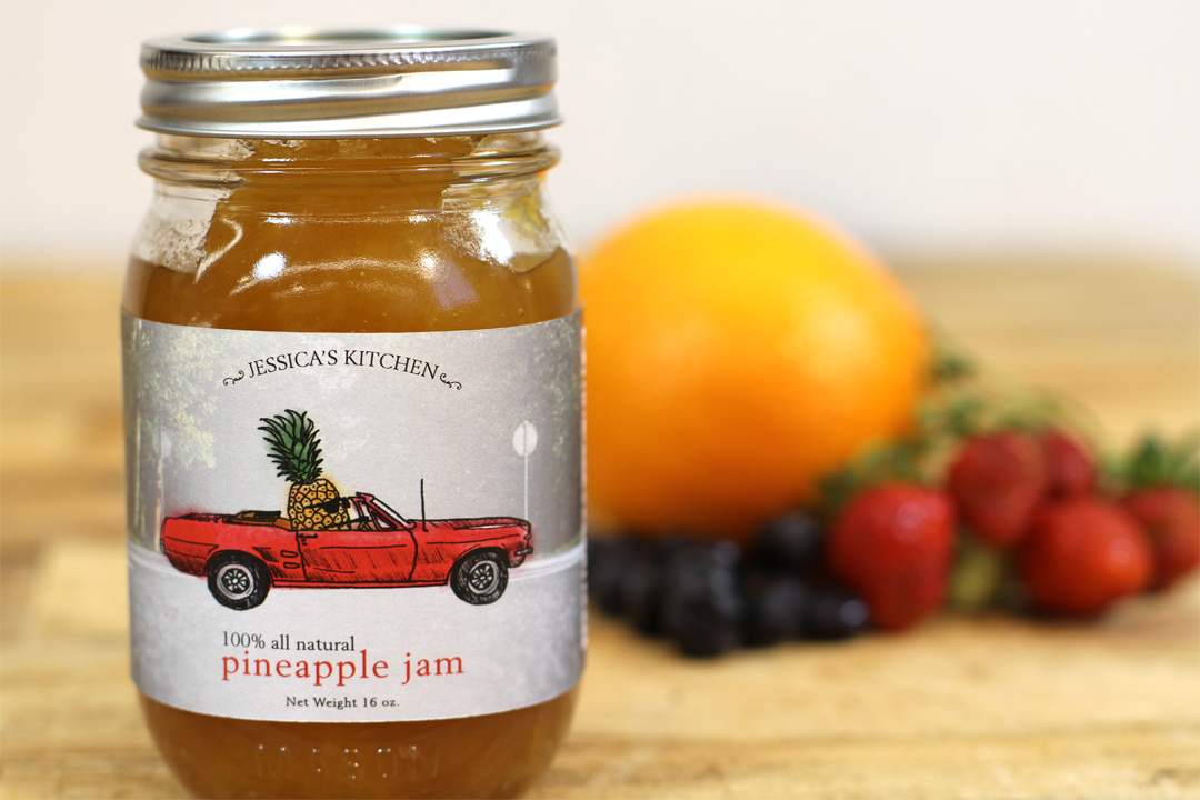 Pineapple jam photographed with fruit on the side